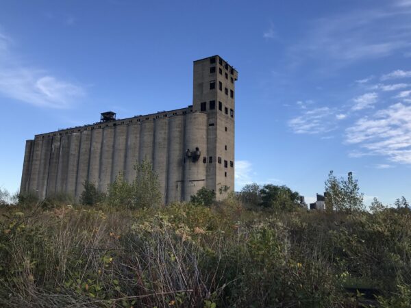 A view of Silo City, a large grain silo on a sunny day.