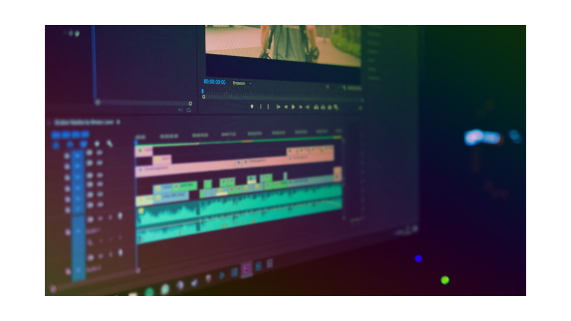 An angled, over the shoulder shot of a computer screen showing a work in progress on the Adobe Premiere editing timeline.