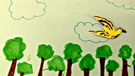 Maria Ziaja, Flying Bird. A drawing of a yellow bird over green tree tops.